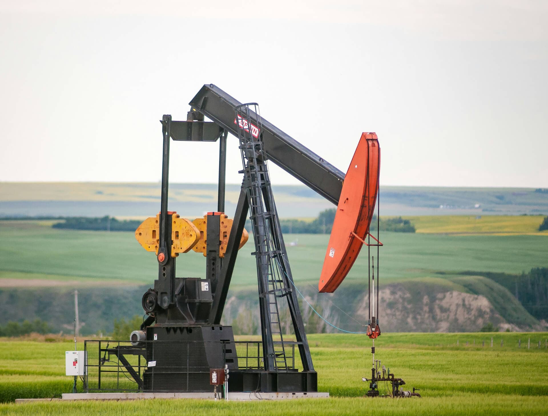 Regulatory compliance and reporting - oil well pumpjack at sunset